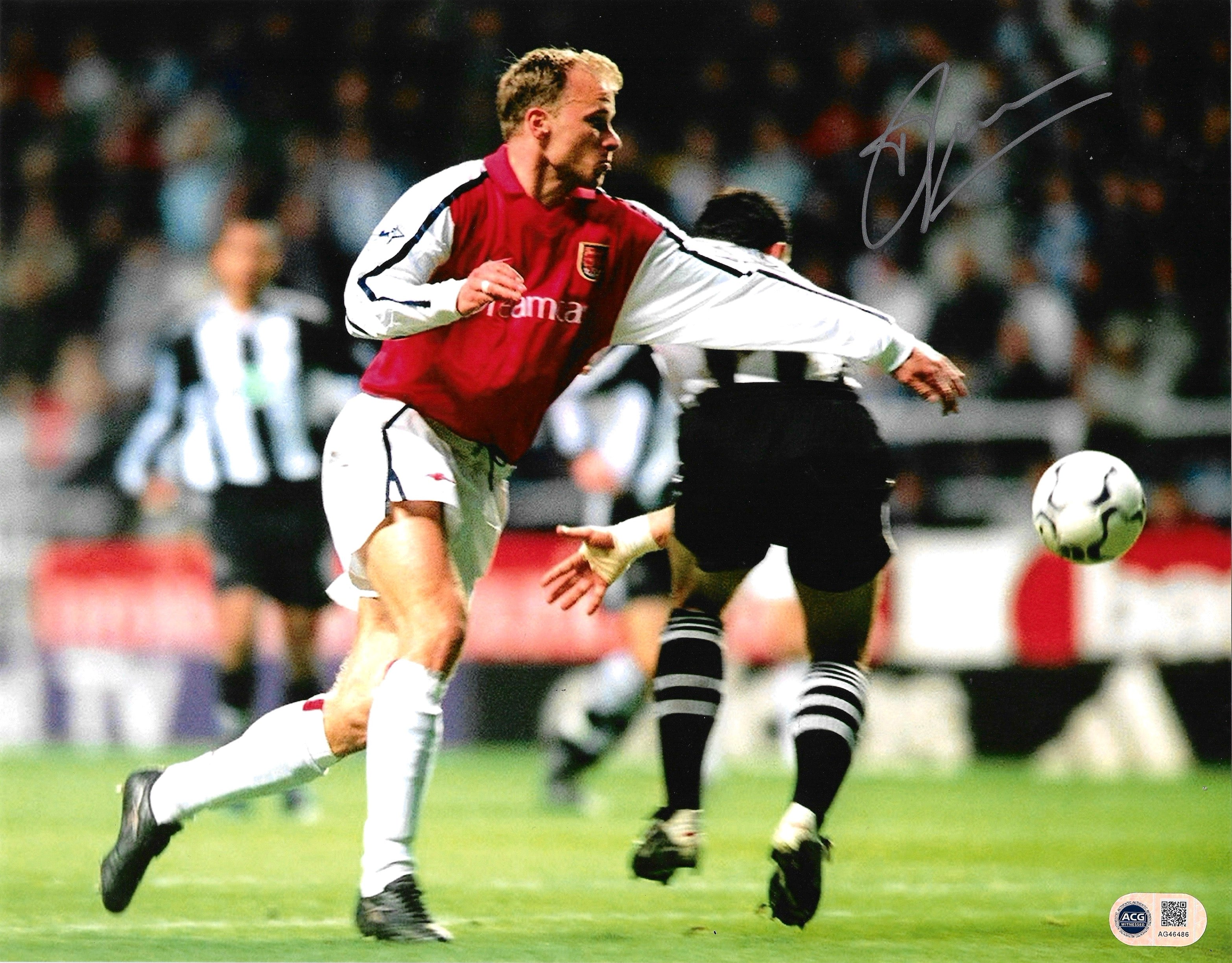 DENNIS BERGKAMP SIGNED ARSENAL 14X11 NEWCASTLE GOAL PHOTO (ACG WITNESS AG46486)