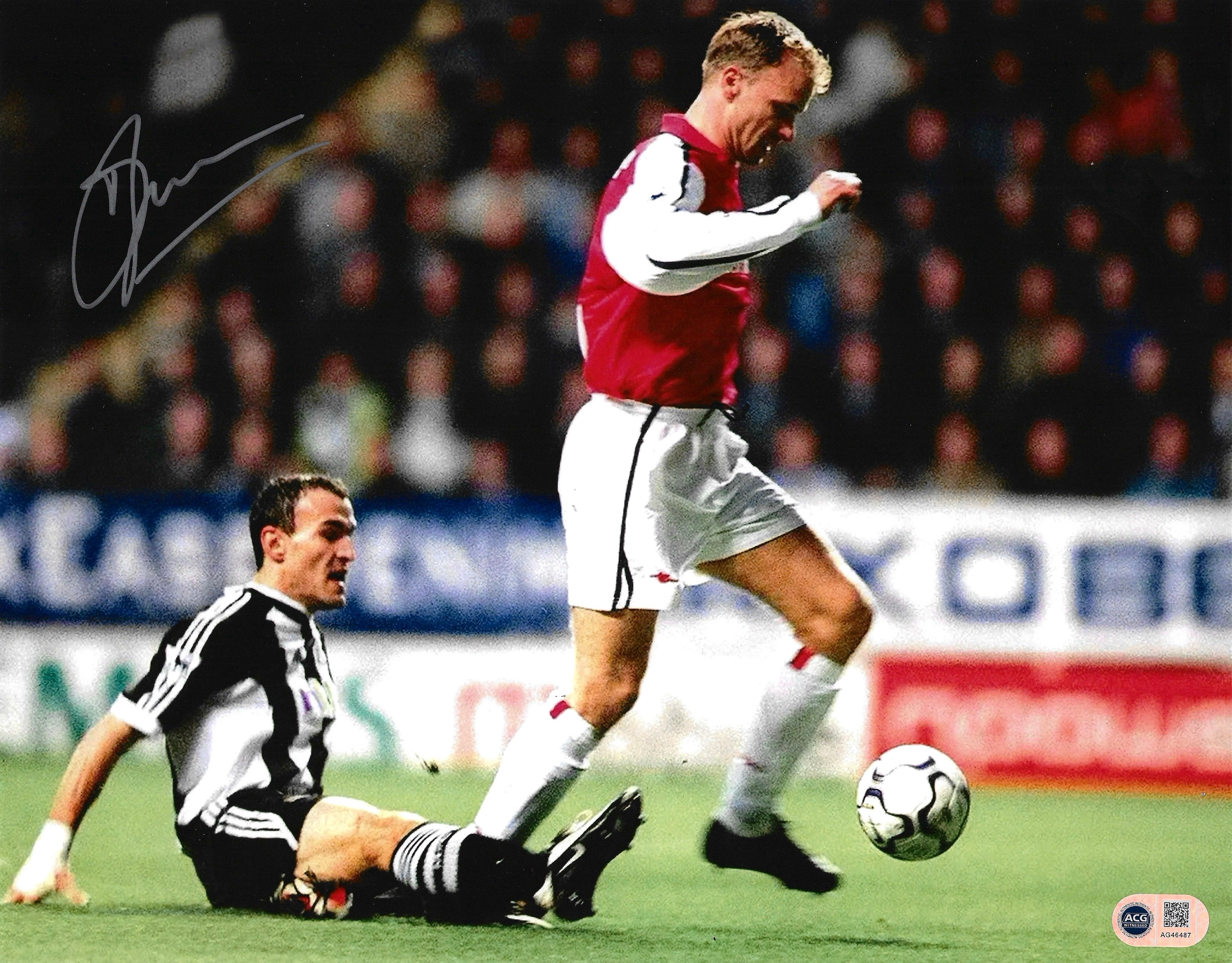 DENNIS BERGKAMP SIGNED ARSENAL 14X11 NEWCASTLE GOAL PHOTO (ACG WITNESS AG46487)